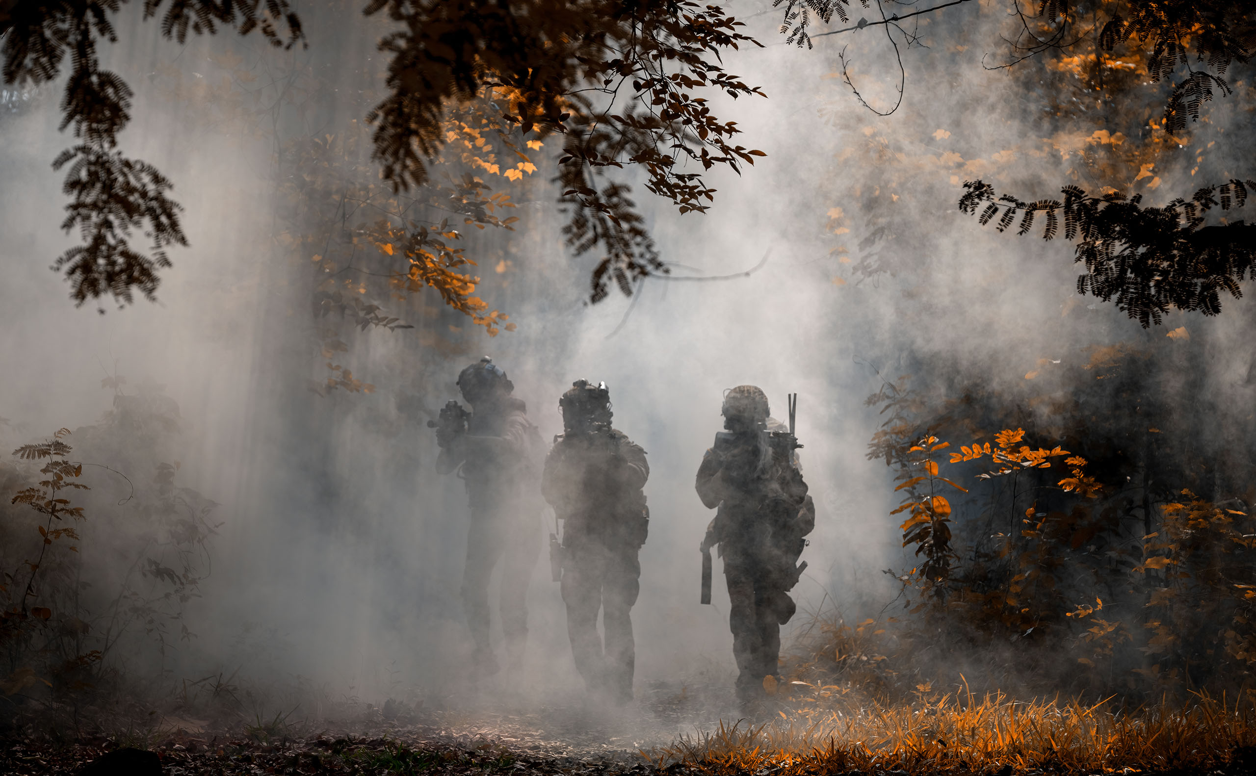 Soldier action with gun on hand holding to protect, survey around safety area in soldier mission with white smoke background.