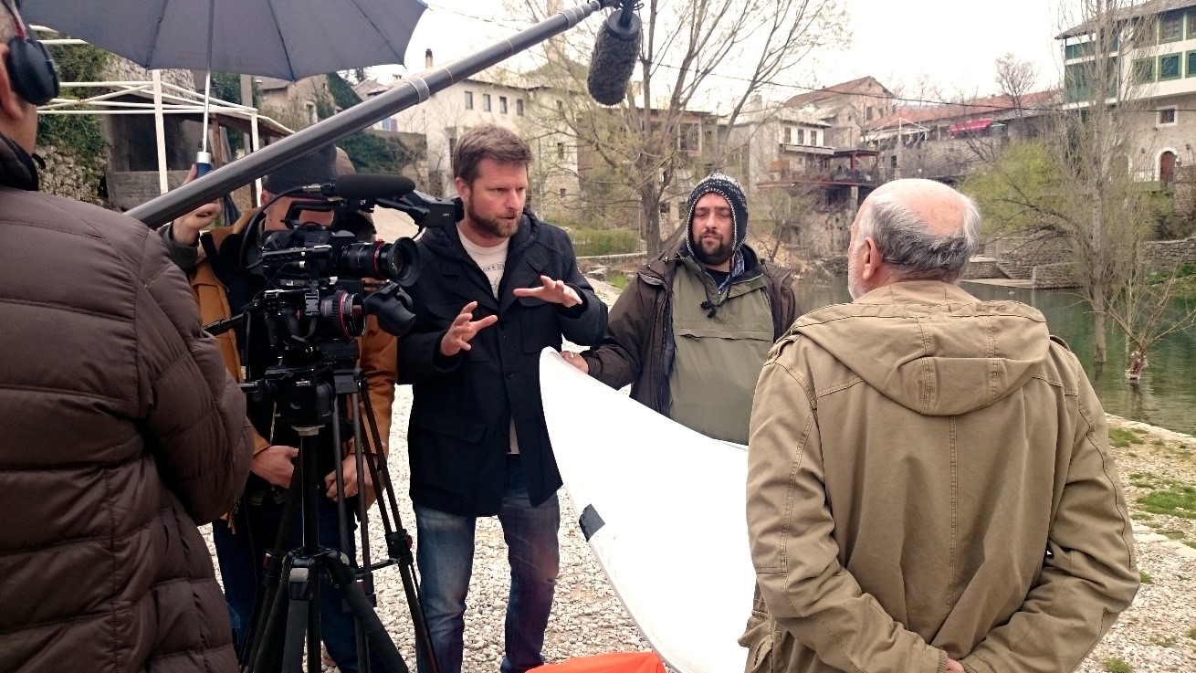Tim Slade interviews Professor Hamidovic in front of the Mostar Bridge, Bosnia & Herzegovina.