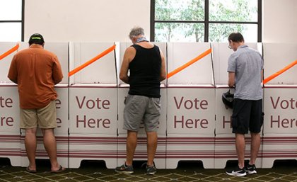 Voting at polling booth during election.