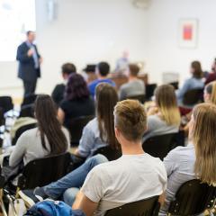 Image of people attending a lecture