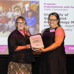 Jane Willcock, Senior Registrar and Museum Operations Coordinator for UQ’s Anthropology Museum accepting the award on behalf of the curatorial team from  Museums and Galleries Queensland’s Chairperson, Karina Devine. Photo credit: Photography by Katie Bennett, courtesy of Museums & Galleries Queensland.
