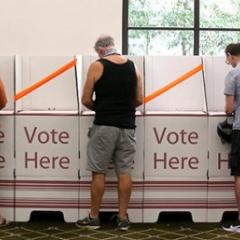 Voting at polling booth during election.