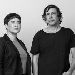 Image: Portrait of curator Ellie Buttrose (left) and artist Archie Moore (right). Photo by Rhett Hammerton, Brisbane 2024.