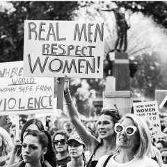 Demonstrators in Sydney rally against gendered violence. Image: Lisa Maree Williams/Getty Images.